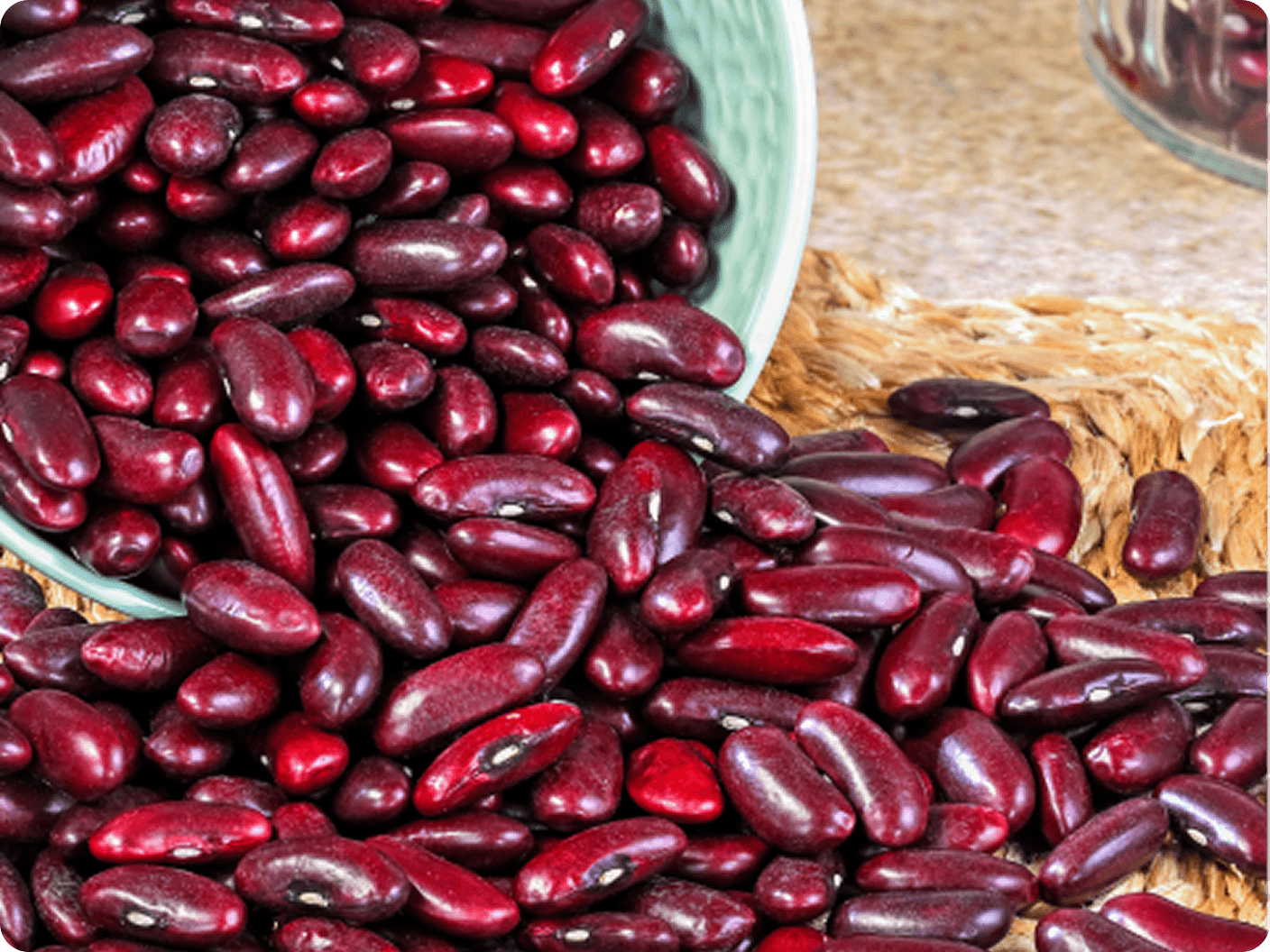 Dark red kidney beans spilling from a bowl