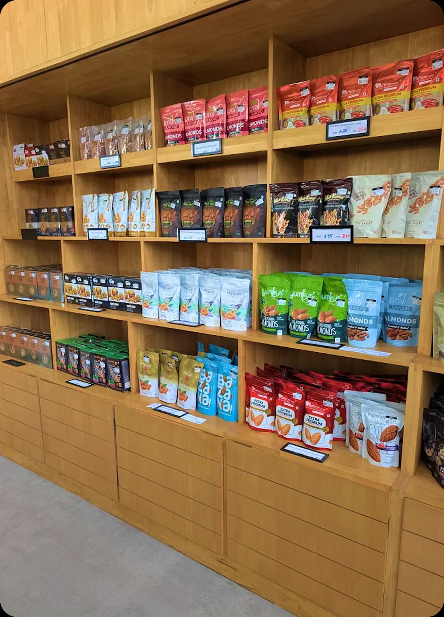 Wooden retail shelves stocked with Thamarai pouches